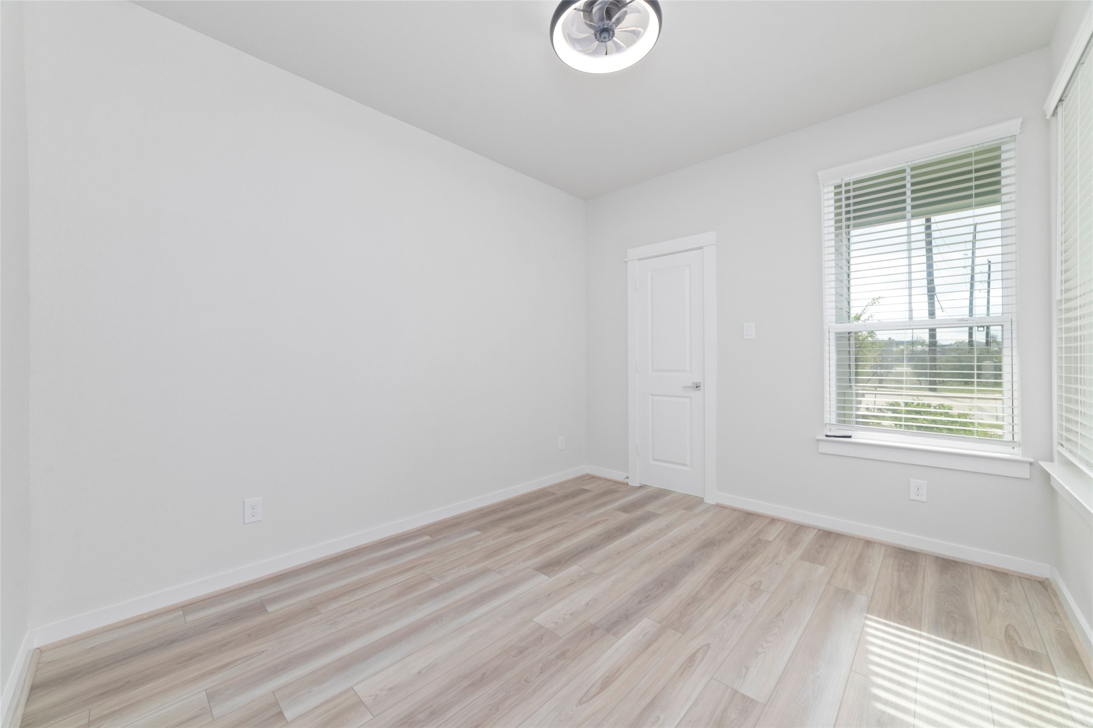 32906 School Hl Road Fulshear, TX 77441 - Photo 4 of 25 an empty room with a window