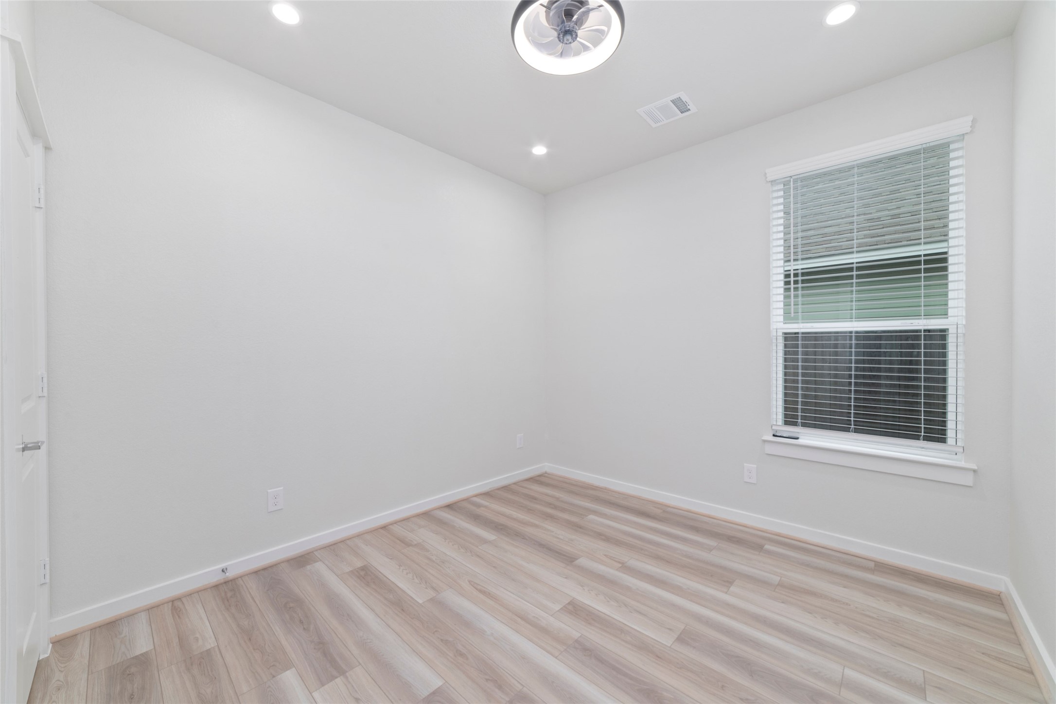 32906 School Hl Road Fulshear, TX 77441 - Photo 9 of 25 a view of empty room with wooden floor