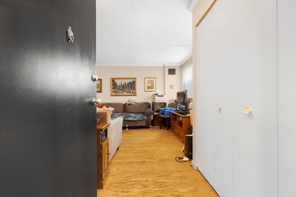 106 13th Street, Unit 114 Boston, MA 02129 - Photo 3 of 42 a bed room with a bed and furniture