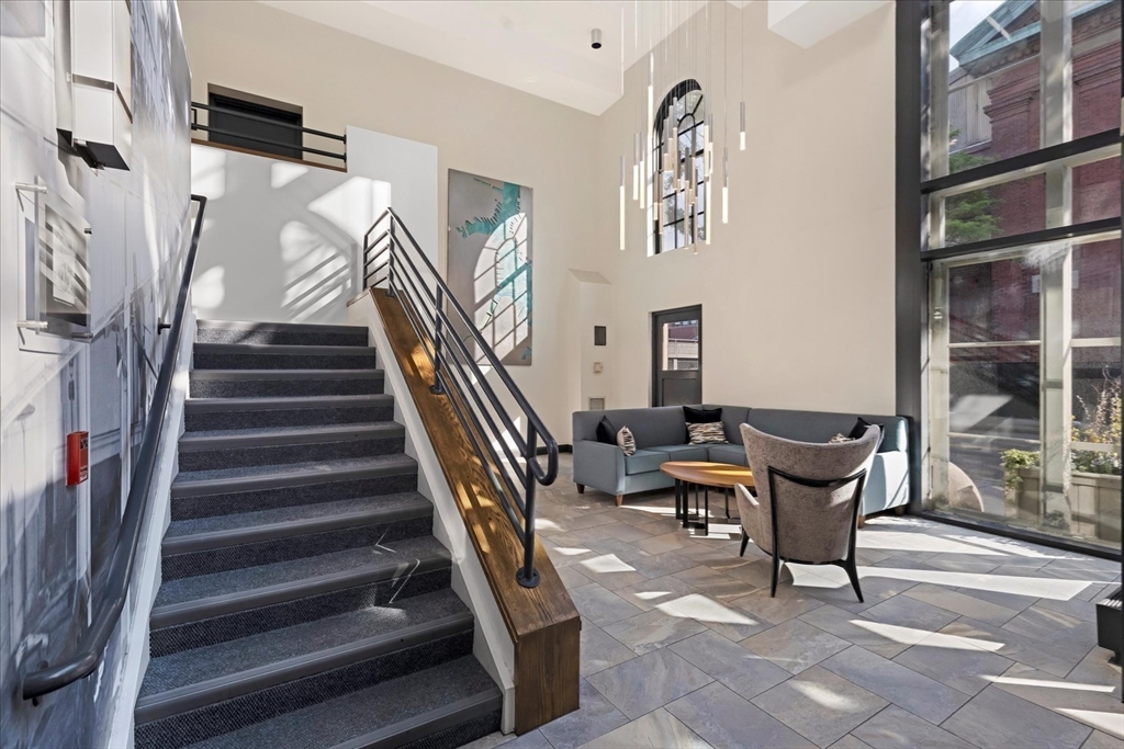 106 13th Street, Unit 114 Boston, MA 02129 - Photo 31 of 42 a workspace with wooden floor and furniture