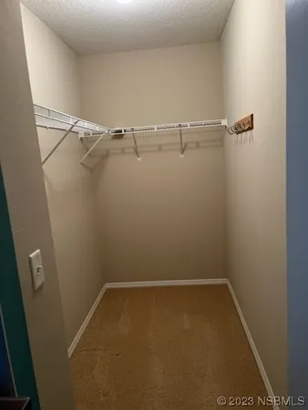 a view of a room with racks on the wall