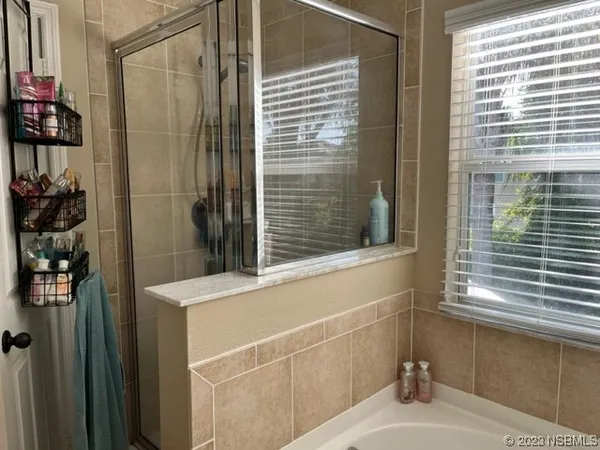a bathroom with a sink and a shower