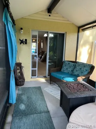 a living room with a couch and a rug