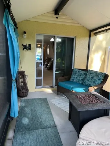 a living room with a couch and a rug