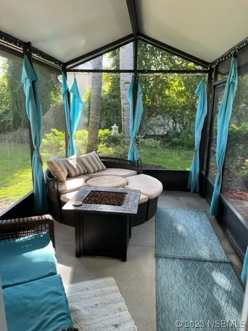 a view of living room with furniture and a tub