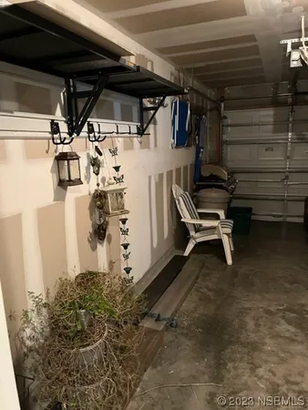 a view of a garage with table and chairs