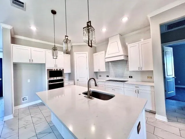 a view of a room with a empty space and a ceiling fan