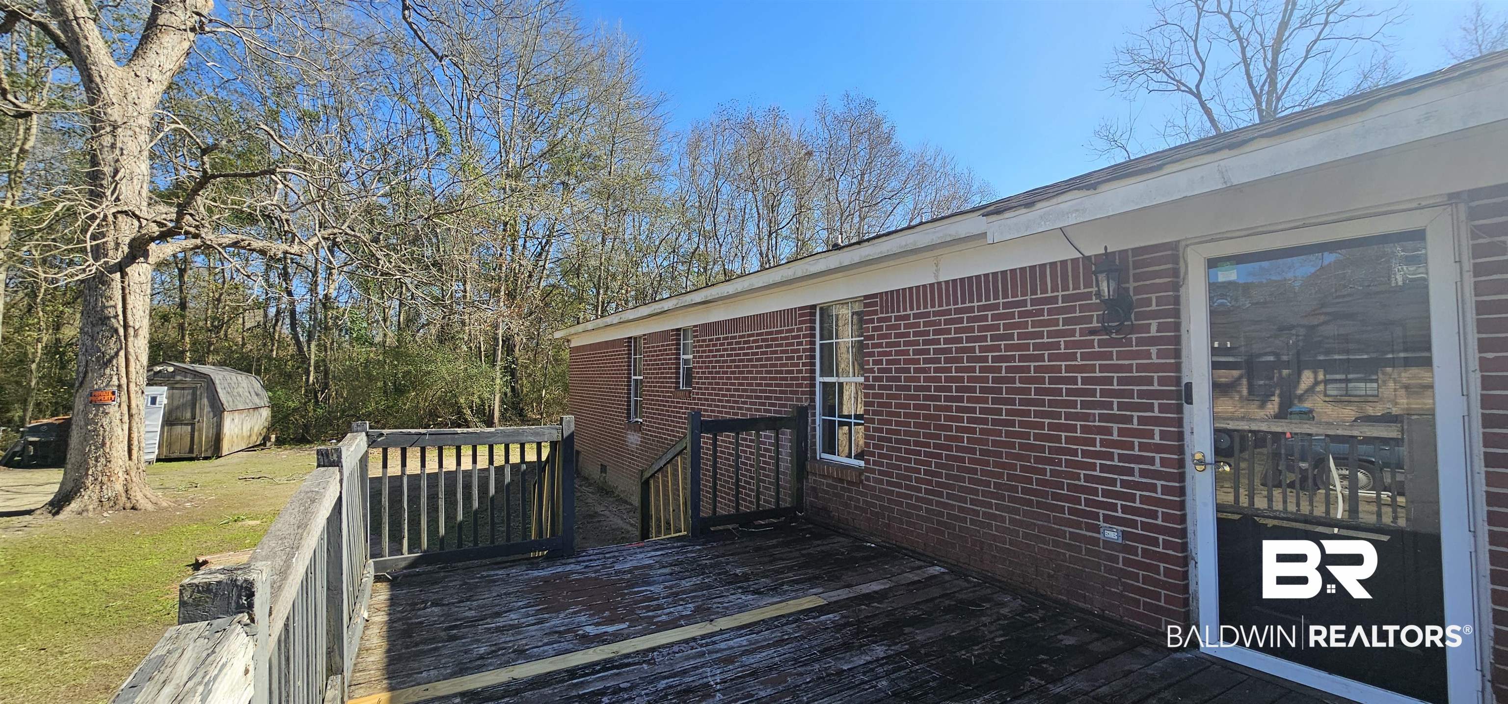 151 Bullard Street Atmore, AL 36502 - Photo 34 of 38 Deck with a shed