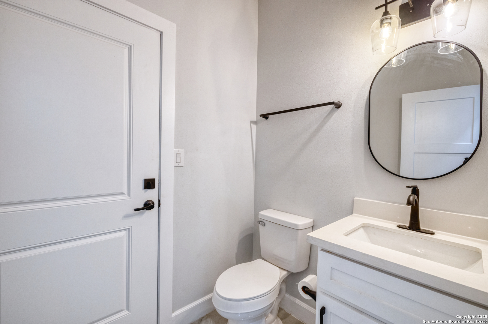 14 Hope Place Uvalde, TX 78801 - Photo 14 of 38 a bathroom with a sink a toilet and a mirror