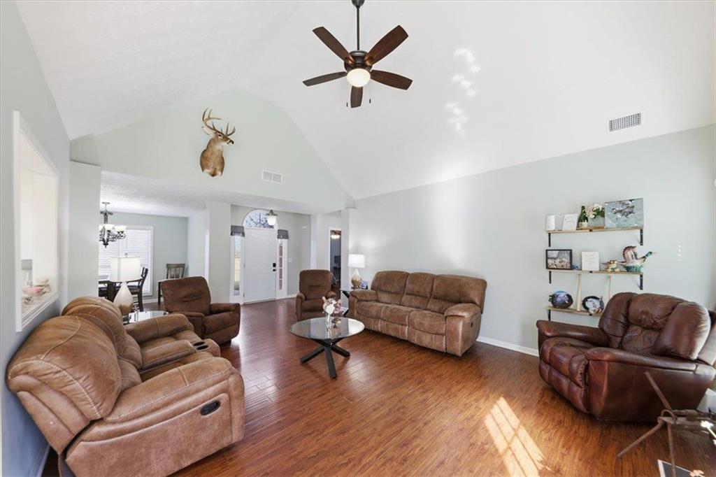 493 Youth Jersey Road Covington, GA 30014 - Photo 13 of 52 a living room with furniture and kitchen view