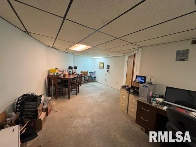 a view of a workspace with furniture