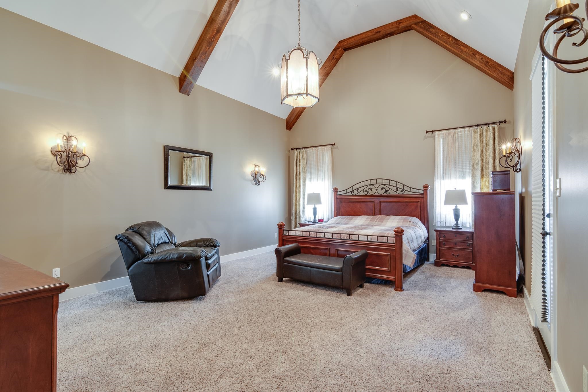 1223 Fall Springs Road Collierville, TN 38017 - Photo 12 of 25 a bedroom with a bed and a chandelier