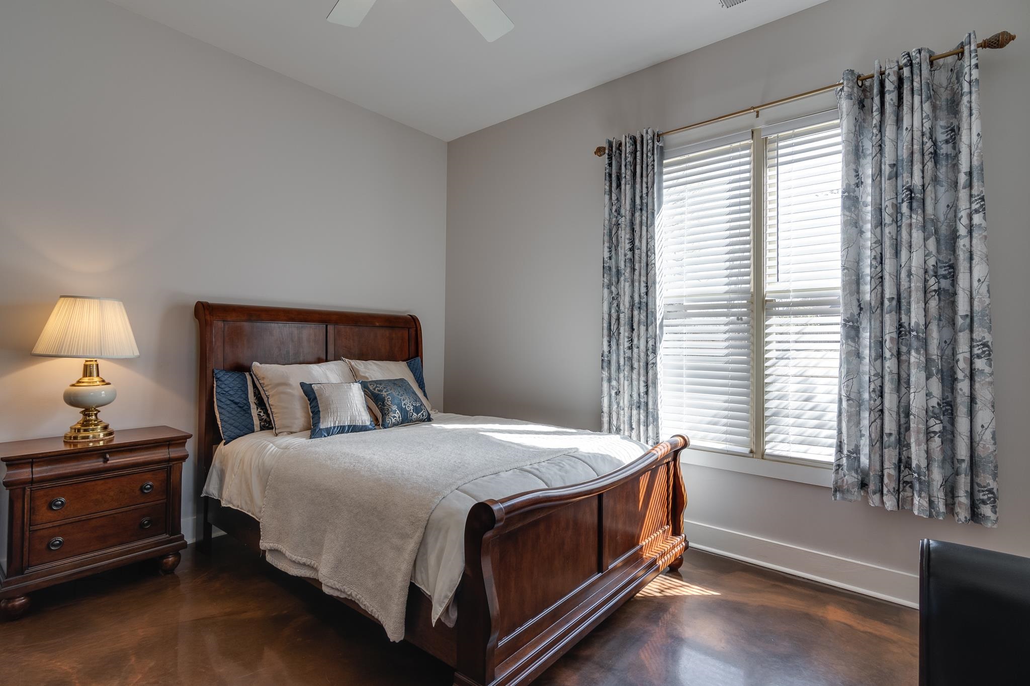 1223 Fall Springs Road Collierville, TN 38017 - Photo 15 of 25 a bedroom with a bed and a night stand