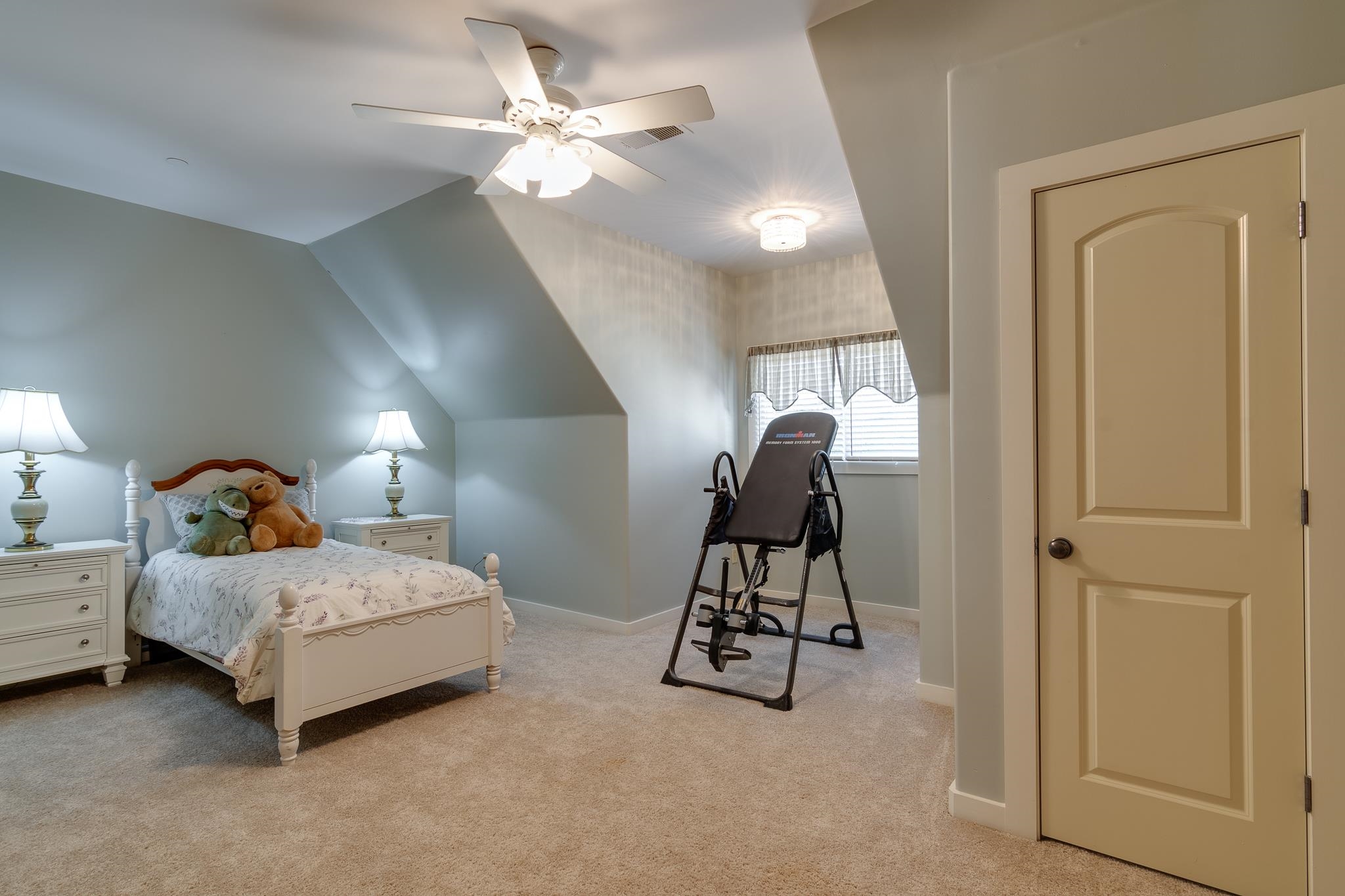 1223 Fall Springs Road Collierville, TN 38017 - Photo 17 of 25 a bedroom with a bed and a chandelier