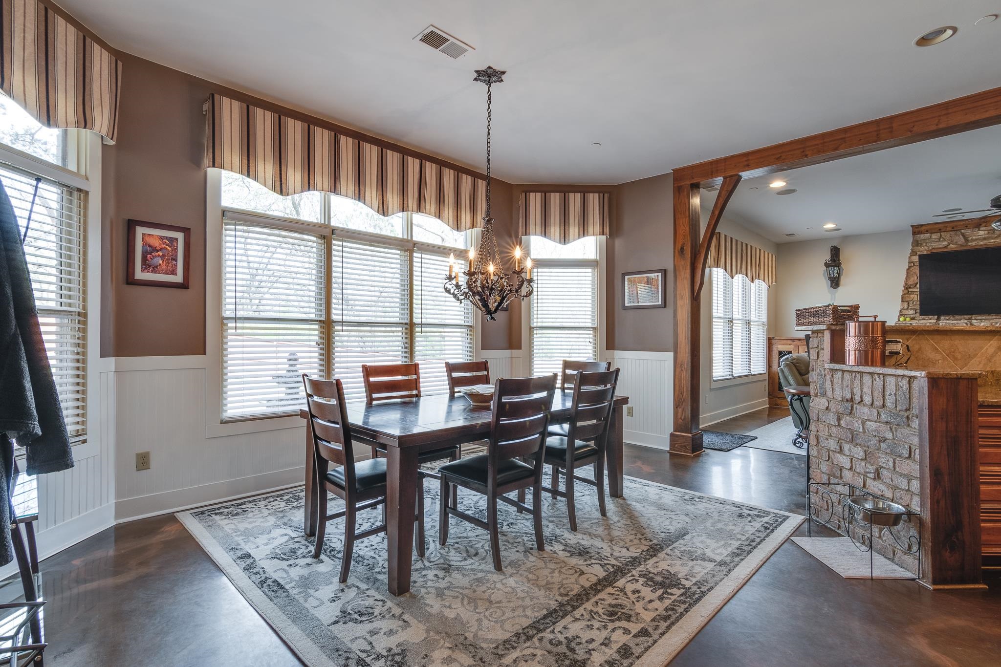 1223 Fall Springs Road Collierville, TN 38017 - Photo 8 of 25 a dining room with furniture a chandelier and wooden floor