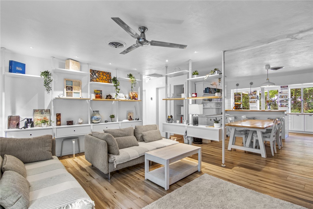 1908 37th Avenue Vero Beach, FL 32960 - Photo 13 of 34 a living room with furniture and a kitchen view