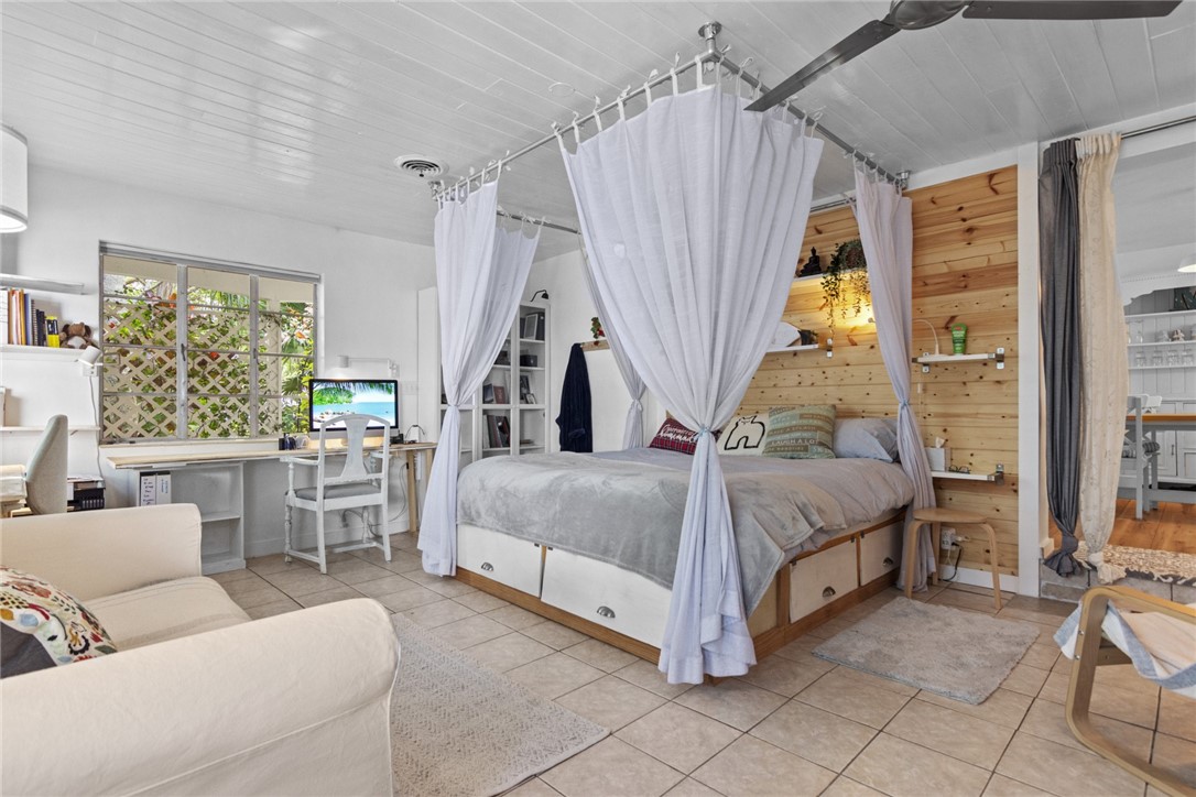 1908 37th Avenue Vero Beach, FL 32960 - Photo 15 of 34 a living room with a bed furniture and a large window