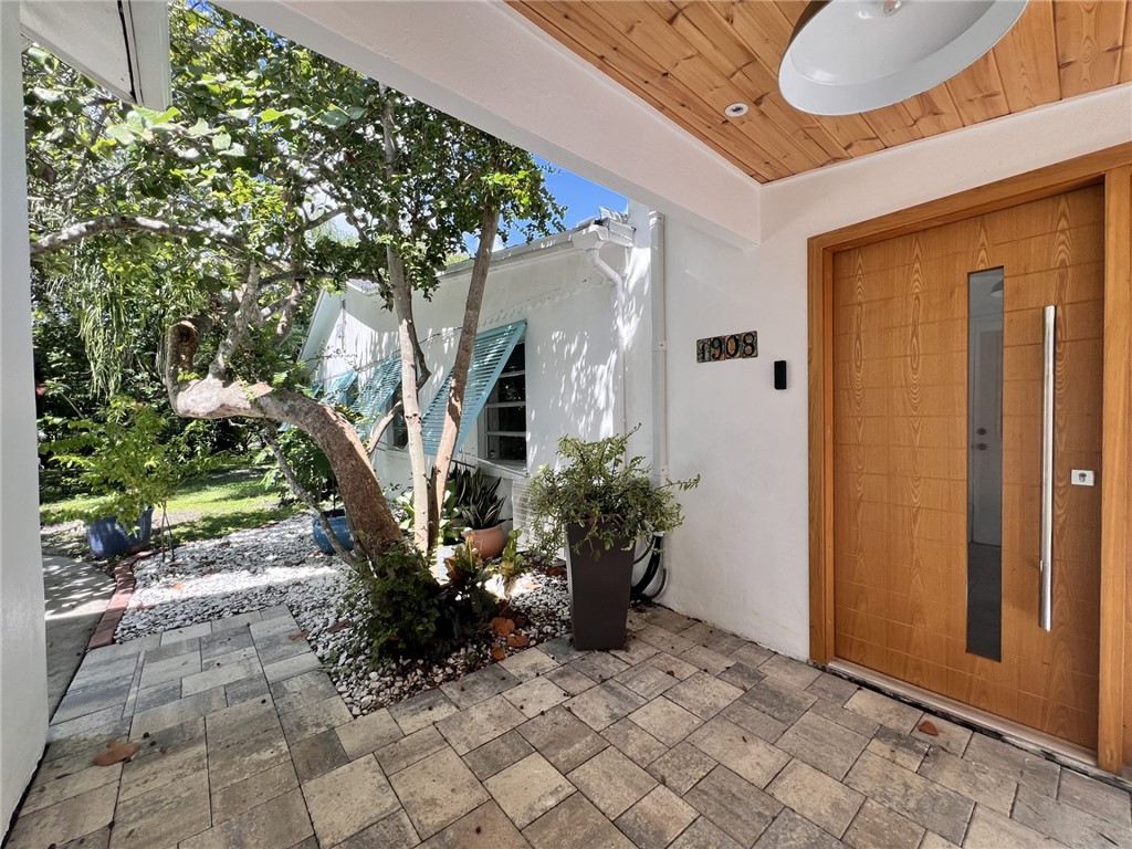 1908 37th Avenue Vero Beach, FL 32960 - Photo 25 of 34 a view of entryway with flower pots