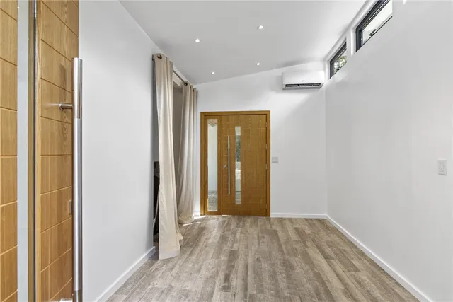 a view of hallway with wooden floor