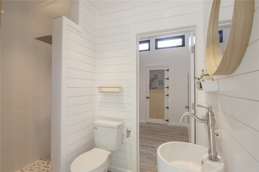 1908 37th Avenue Vero Beach, FL 32960 - Photo 28 of 34 a bathroom with a toilet and a shower