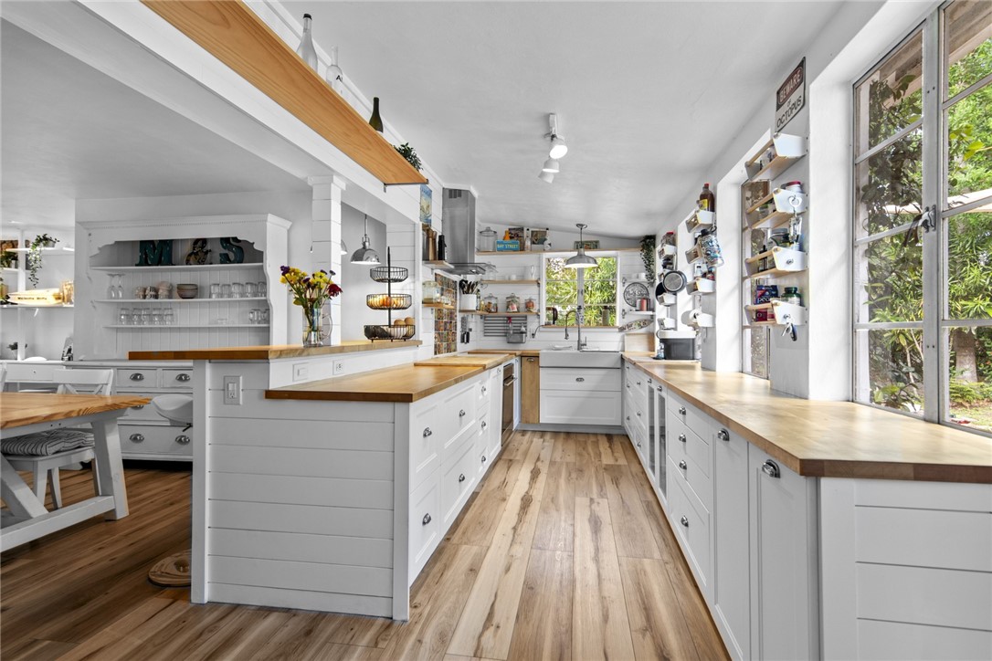 1908 37th Avenue Vero Beach, FL 32960 - Photo 3 of 34 a kitchen with stainless steel appliances granite countertop lots of counter top space and a sink