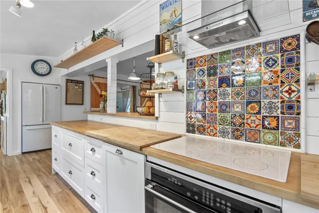 a kitchen with stainless steel appliances granite countertop a sink and cabinets