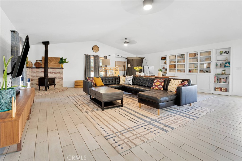 37077 Coyote Lake Road Newberry Springs, CA 92365 - Photo 15 of 58 a living room with furniture and a couch