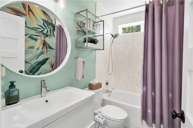 a bathroom with a granite countertop sink mirror and double