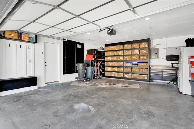 a view of a swimming pool with a yard and sitting area