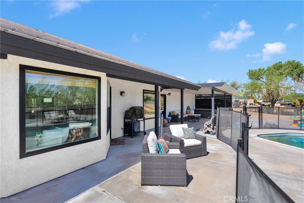 37077 Coyote Lake Road Newberry Springs, CA 92365 - Photo 38 of 58 a living room with furniture and a large window