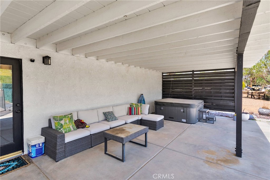 37077 Coyote Lake Road Newberry Springs, CA 92365 - Photo 39 of 58 a living room with furniture and a fireplace