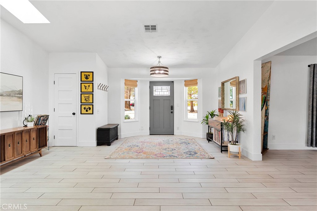 37077 Coyote Lake Road Newberry Springs, CA 92365 - Photo 4 of 58 a view of a bedroom with window and furniture
