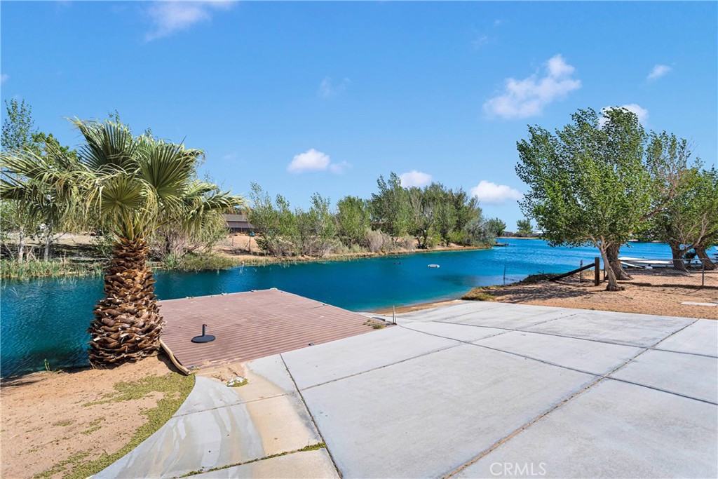 37077 Coyote Lake Road Newberry Springs, CA 92365 - Photo 45 of 58 a view of swimming pool with an outdoor space and seating area