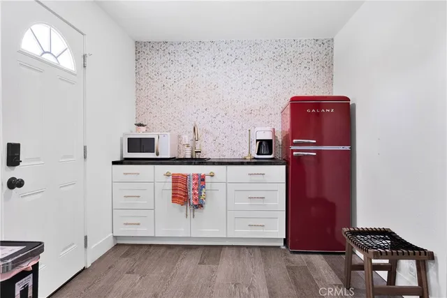 an aerial view of a house with table and chairs