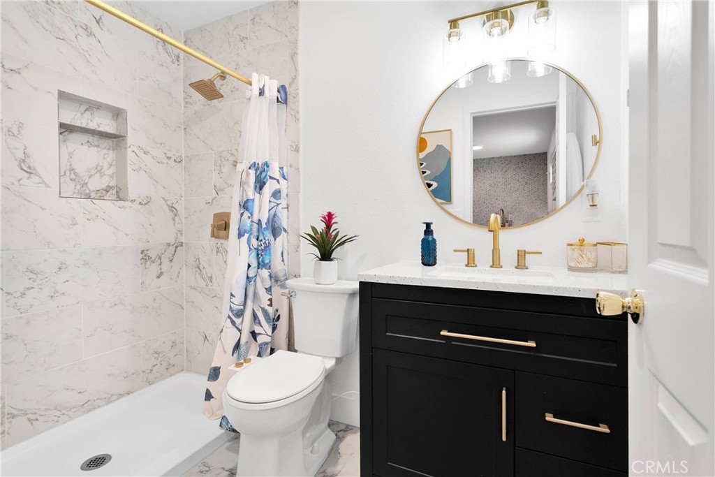 37077 Coyote Lake Road Newberry Springs, CA 92365 - Photo 54 of 58 a bathroom with a sink vanity mirror and toilet