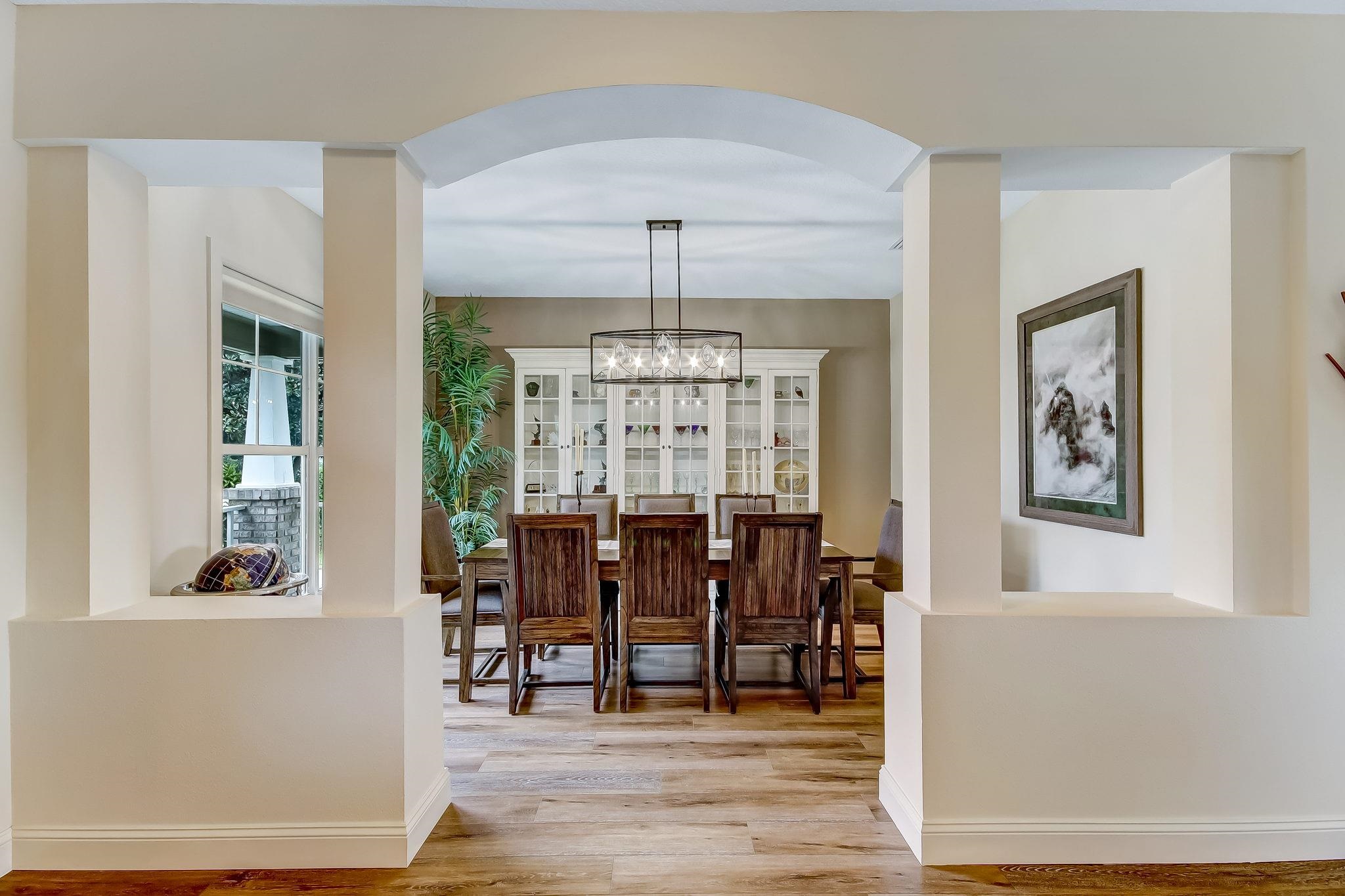 644 Sun Down Circle St. Augustine, FL 32080 - Photo 11 of 69 a view of a dining room with furniture window and wooden floor