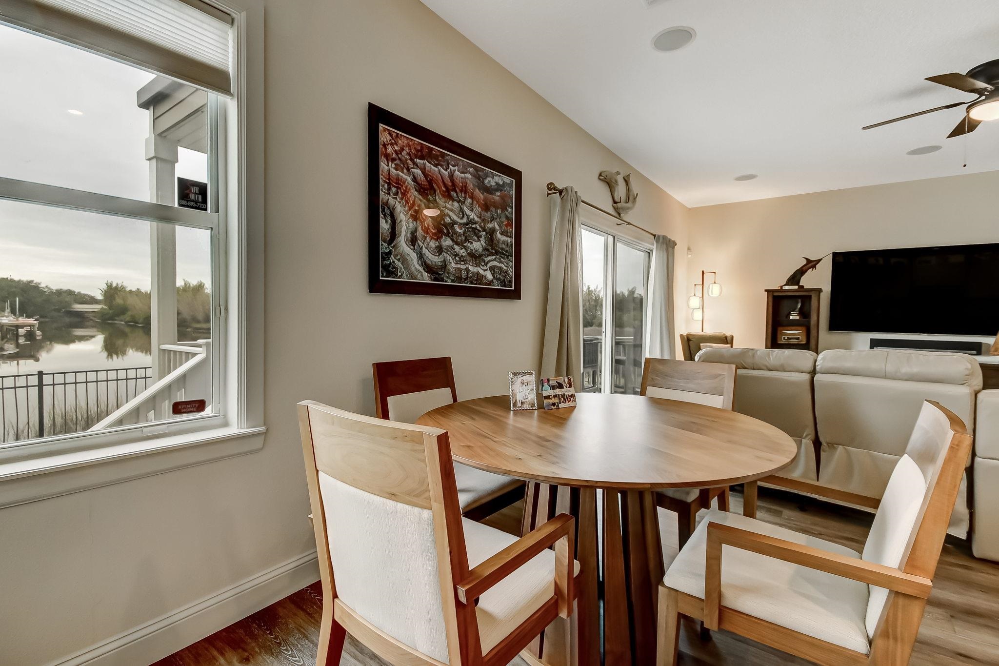 644 Sun Down Circle St. Augustine, FL 32080 - Photo 23 of 69 a view of a dining room with furniture window and wooden floor