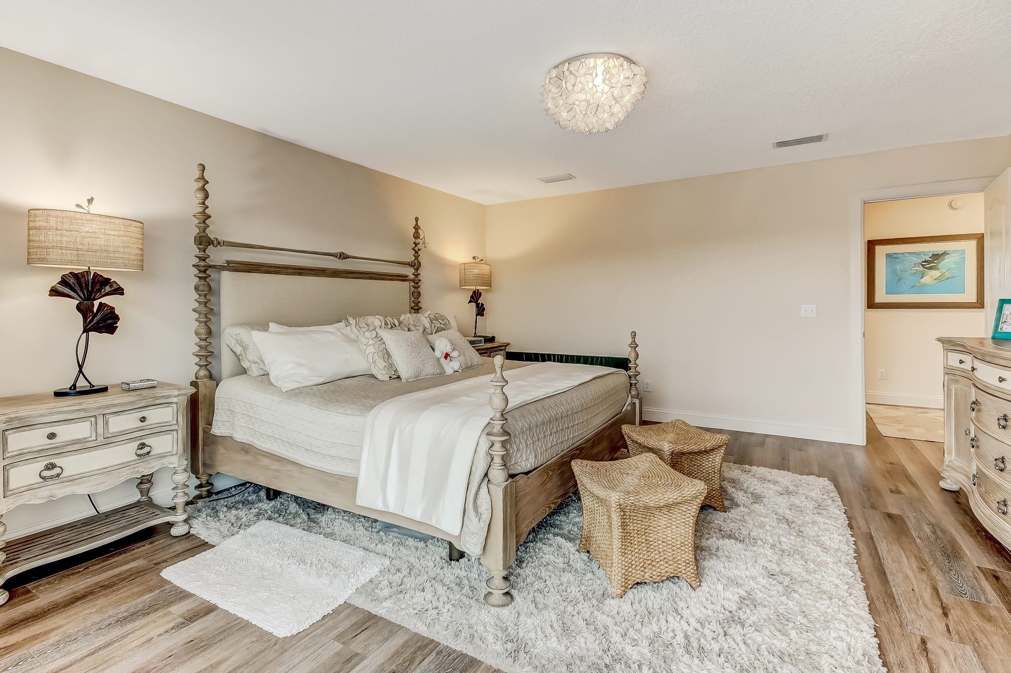 644 Sun Down Circle St. Augustine, FL 32080 - Photo 27 of 69 a bedroom with a bed and a tv on the dresser