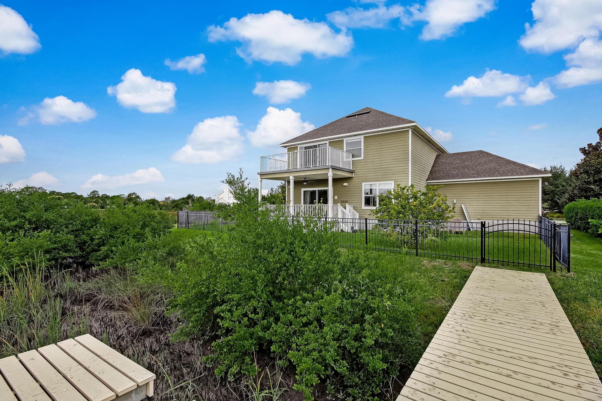 644 Sun Down Circle St. Augustine, FL 32080 - Photo 51 of 69 a front view of a house with a yard