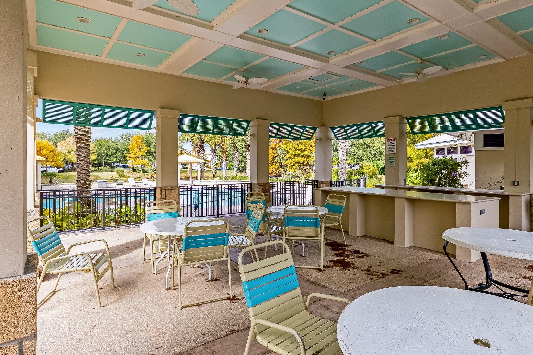 644 Sun Down Circle St. Augustine, FL 32080 - Photo 64 of 69 a living room with patio furniture and a floor to ceiling window