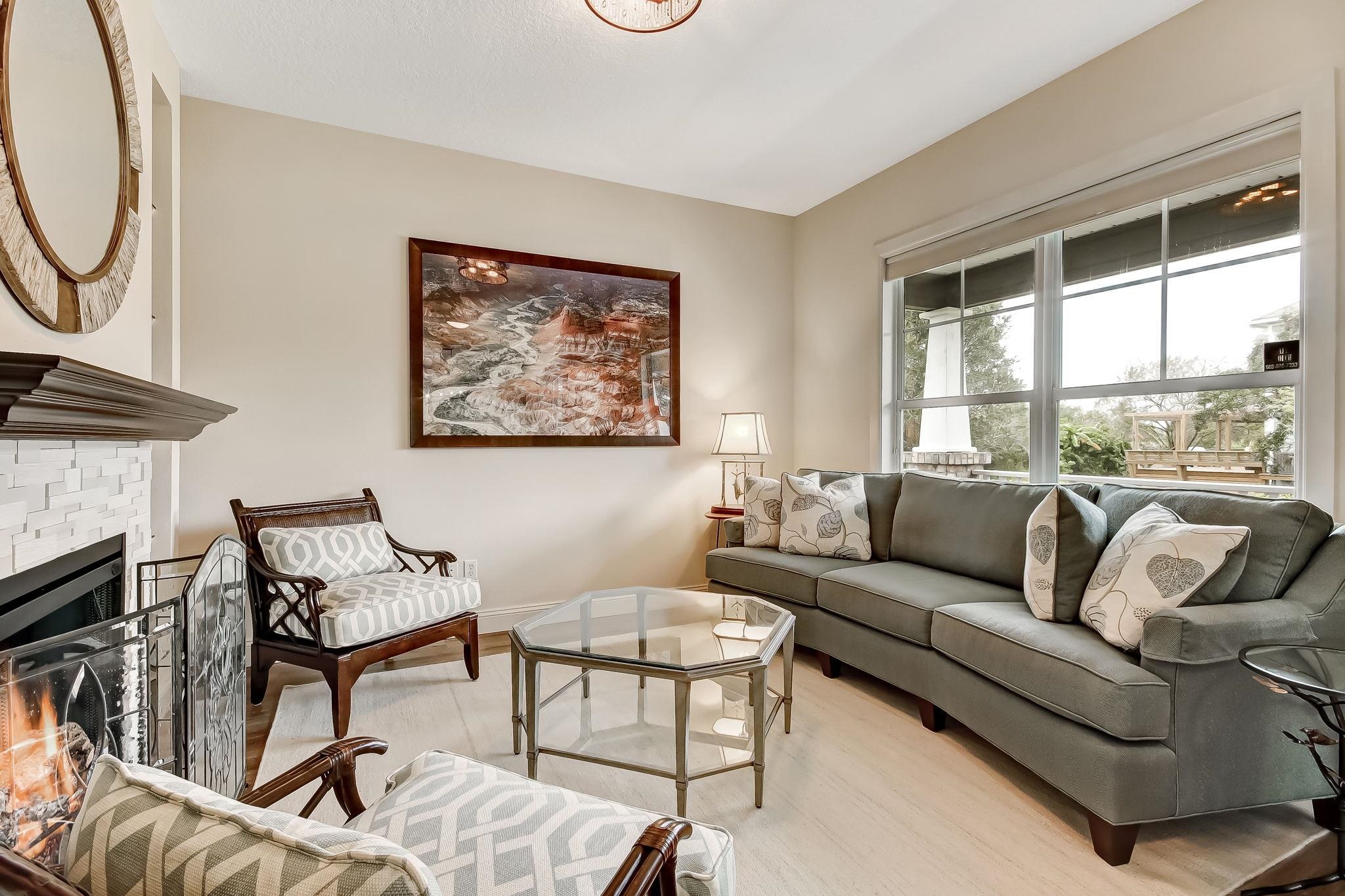 644 Sun Down Circle St. Augustine, FL 32080 - Photo 9 of 69 a living room with furniture and a floor to ceiling window