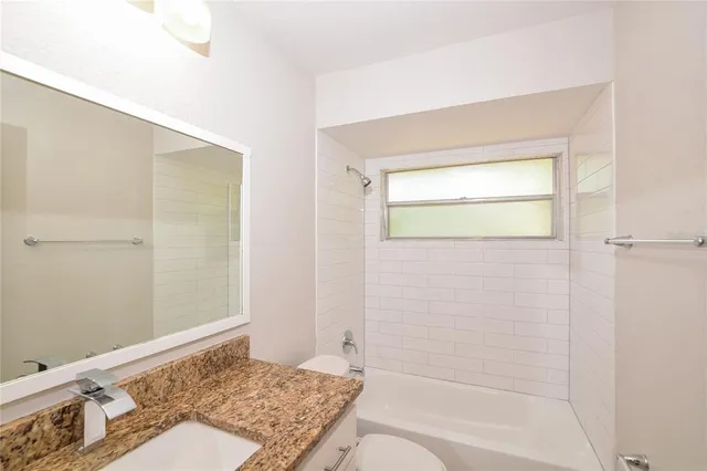 a bathroom with a bath tub and a shower