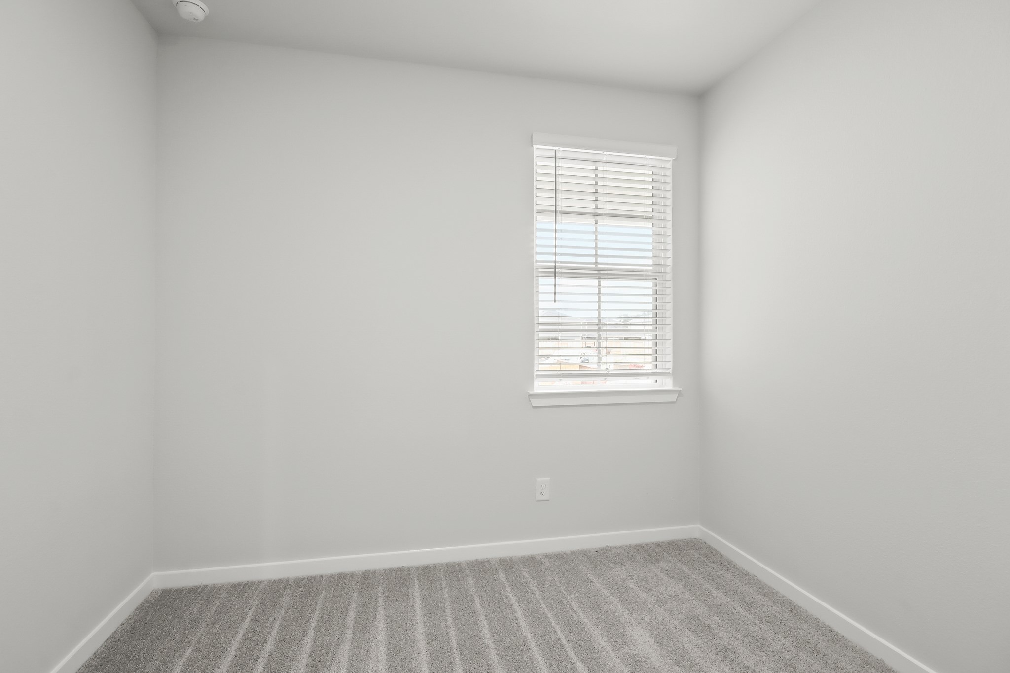 225 Spring Drive Hockley, TX 77447 - Photo 17 of 24 an empty room with a window