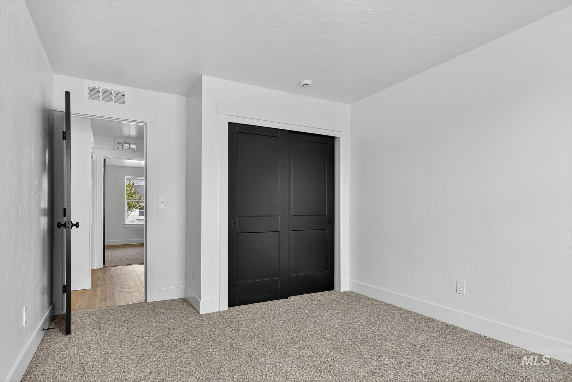 1164 Velvet Loop Wilder, ID 83676 - Photo 23 of 35 Unfurnished bedroom featuring carpet flooring and a closet