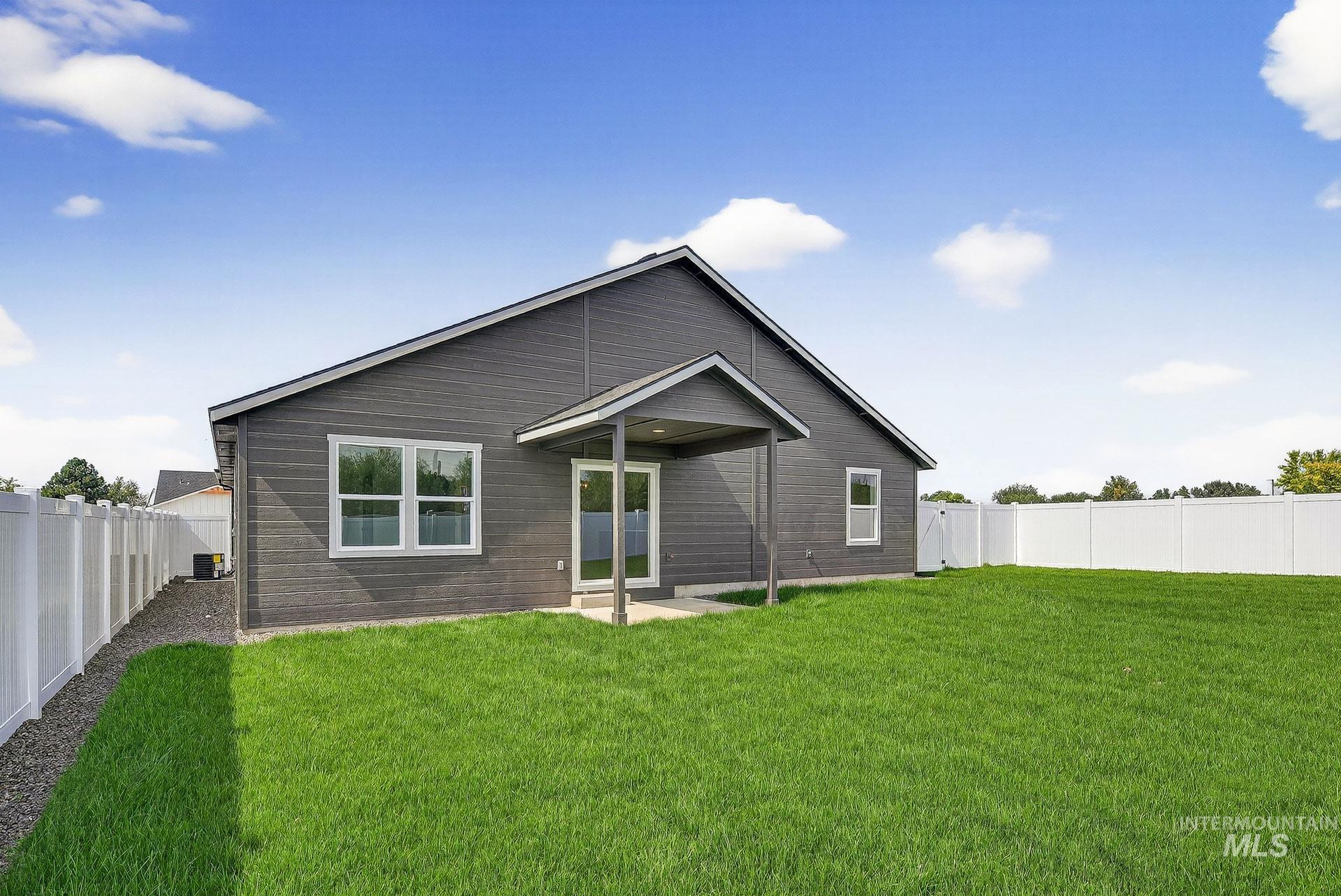 1164 Velvet Loop Wilder, ID 83676 - Photo 33 of 35 Rear view of property featuring a patio area and a fenced backyard