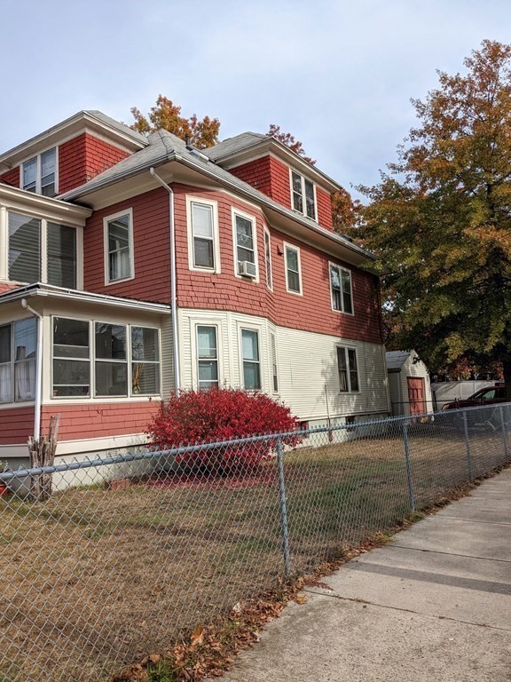 73-75 Sylvan Street Springfield, MA 01108 - Photo 2 of 15 a front view of a house with a yard