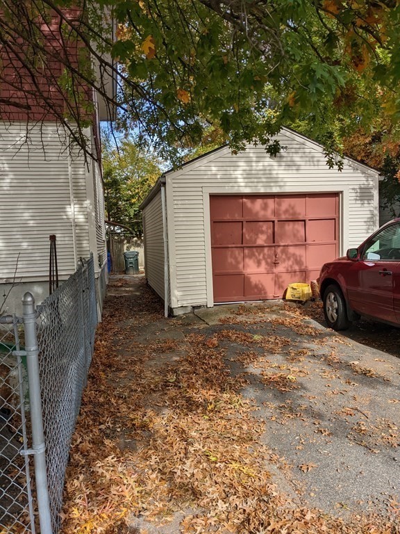 73-75 Sylvan Street Springfield, MA 01108 - Photo 3 of 15 a front view of a house with a yard and garage