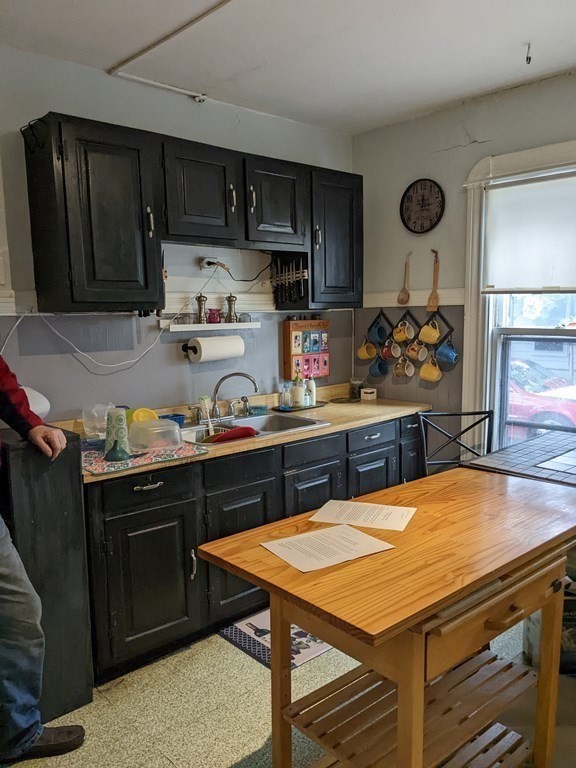 73-75 Sylvan Street Springfield, MA 01108 - Photo 5 of 15 a kitchen with a table and chairs in it