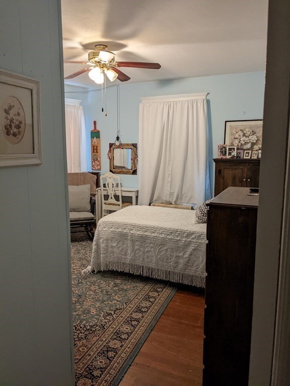 73-75 Sylvan Street Springfield, MA 01108 - Photo 8 of 15 a bedroom with a bed and a chandelier