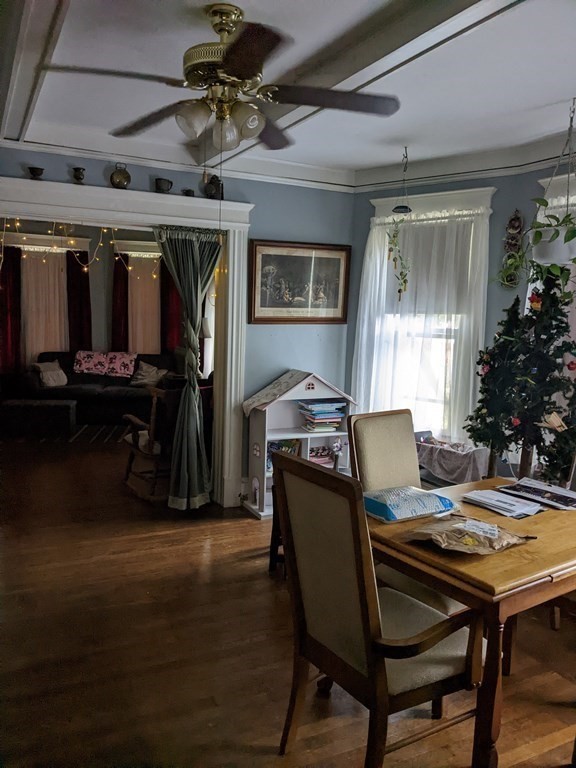 73-75 Sylvan Street Springfield, MA 01108 - Photo 9 of 15 a view of a dining room with furniture and wooden floor